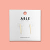 ABLE x Annie F. Downs gold bar earrings packaging