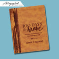 100 Days to Brave leather autographed devotional on a blue background Annie Downs