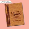 100 Day to Brave leather autographed devotional on a pink background Annie Downs