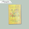 A Life of Lovely autographed book on a green background Annie Downs