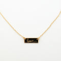 ABLE x Annie F. Downs engraved brave gold bar necklace close up 